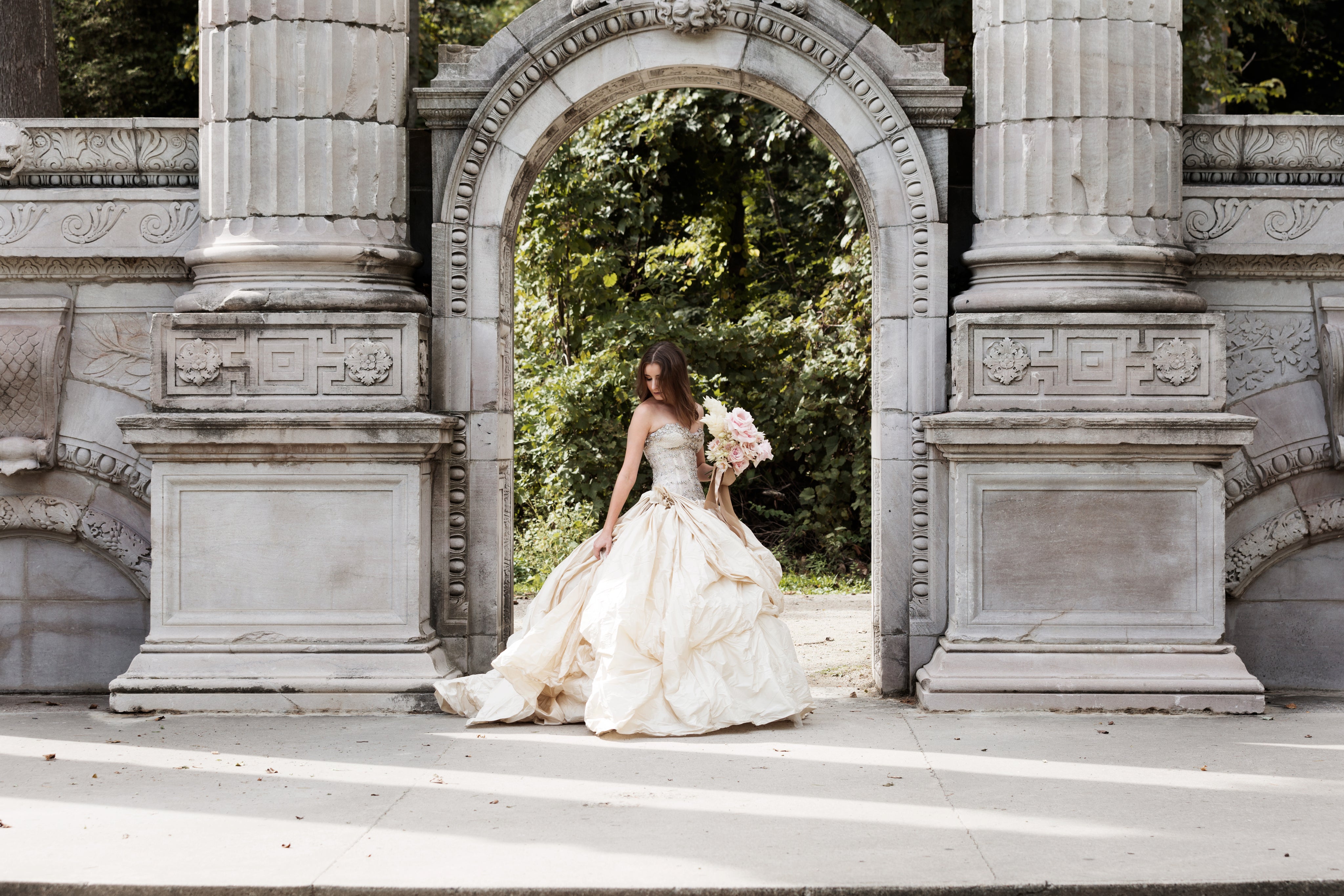 bride-in-wedding-dress-near-archway.jpg